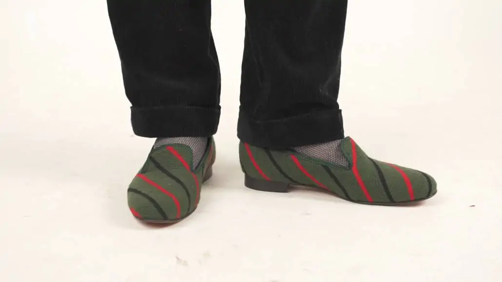 Albert Slippers in needlepoint green with red and black stripes.