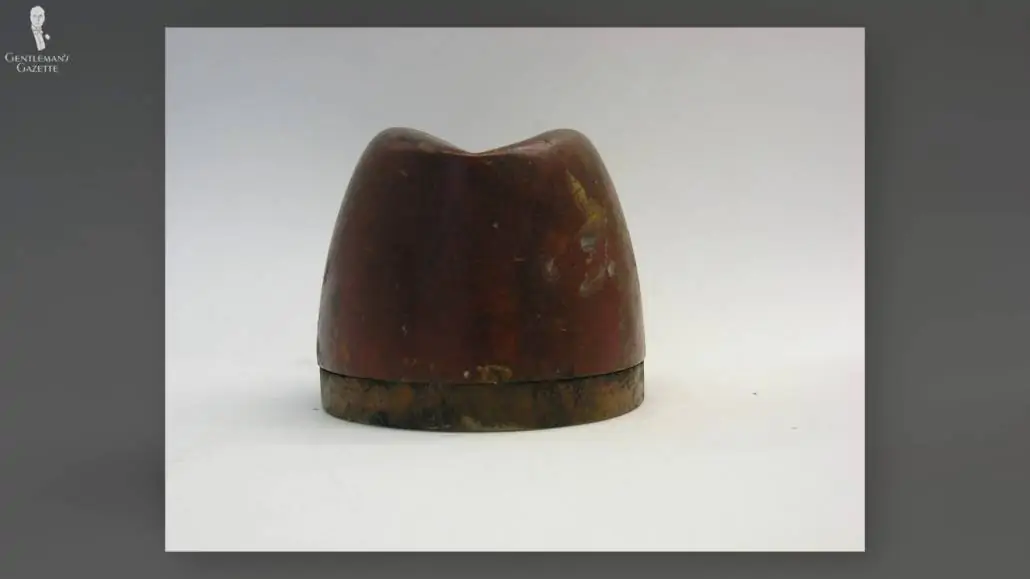 A hat block is what's commonly used for shaping (or reshaping) a hat.