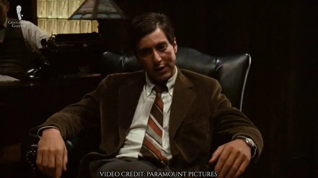 Michael Corleone wearing a brown corduroy jacket.