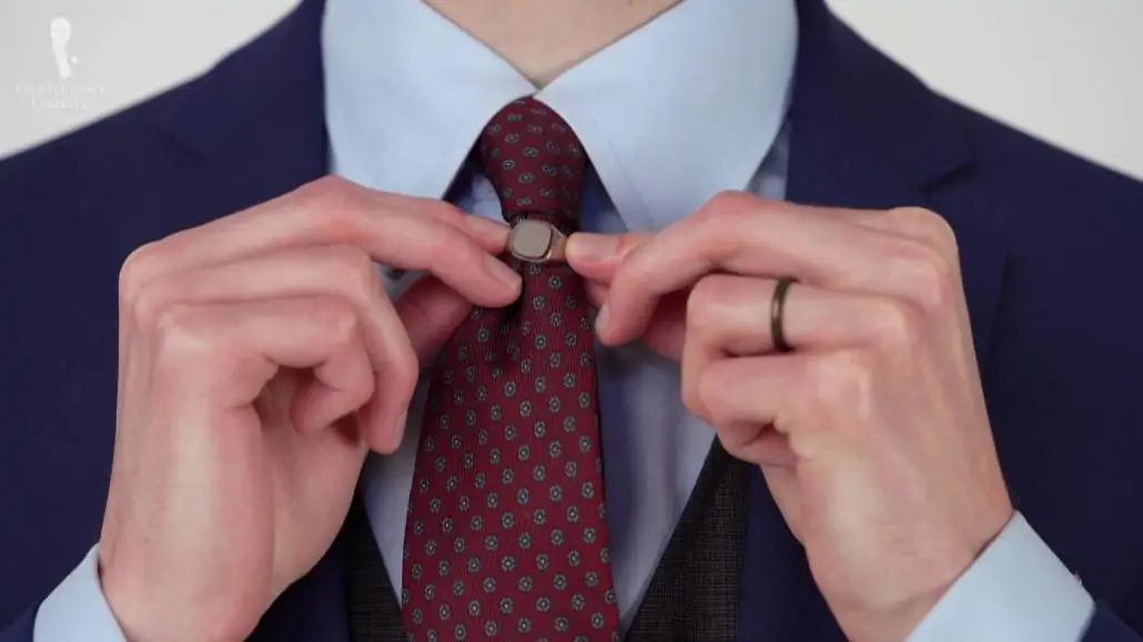 Preston wearing a signet ring on his tie.