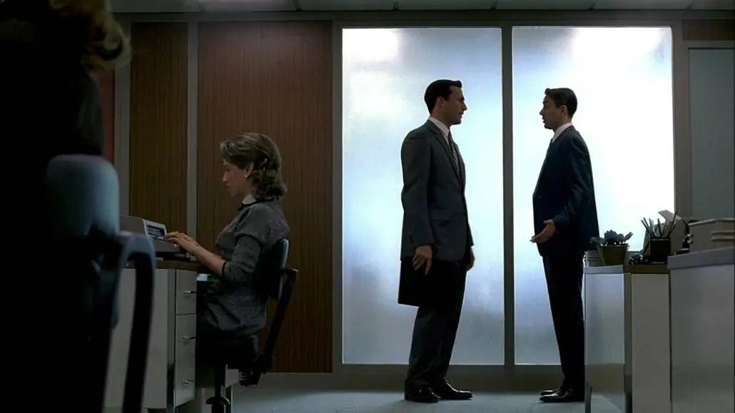 Don Draper and Peter Campbell having a conversation; Both are wearing a business suit.