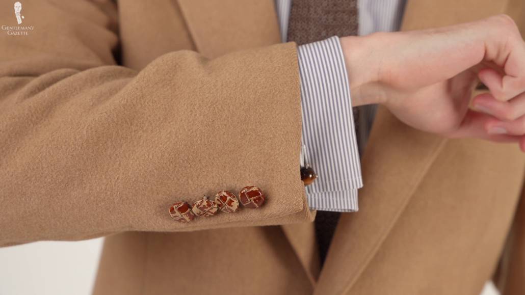 Leather buttons on a camel sport  coat.