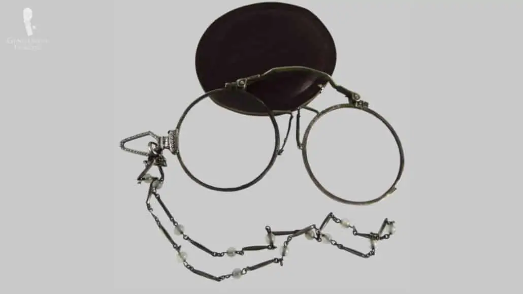 A pince-nez or a pinch nose style glasses.