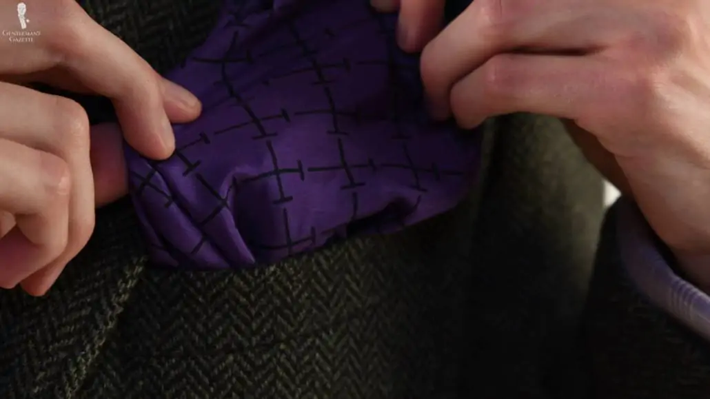 Preston's vintage purple pocket square with a linear pattern.
