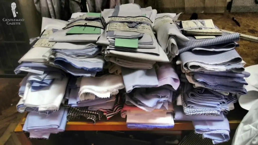 A pile of fabric used for bespoke shirts