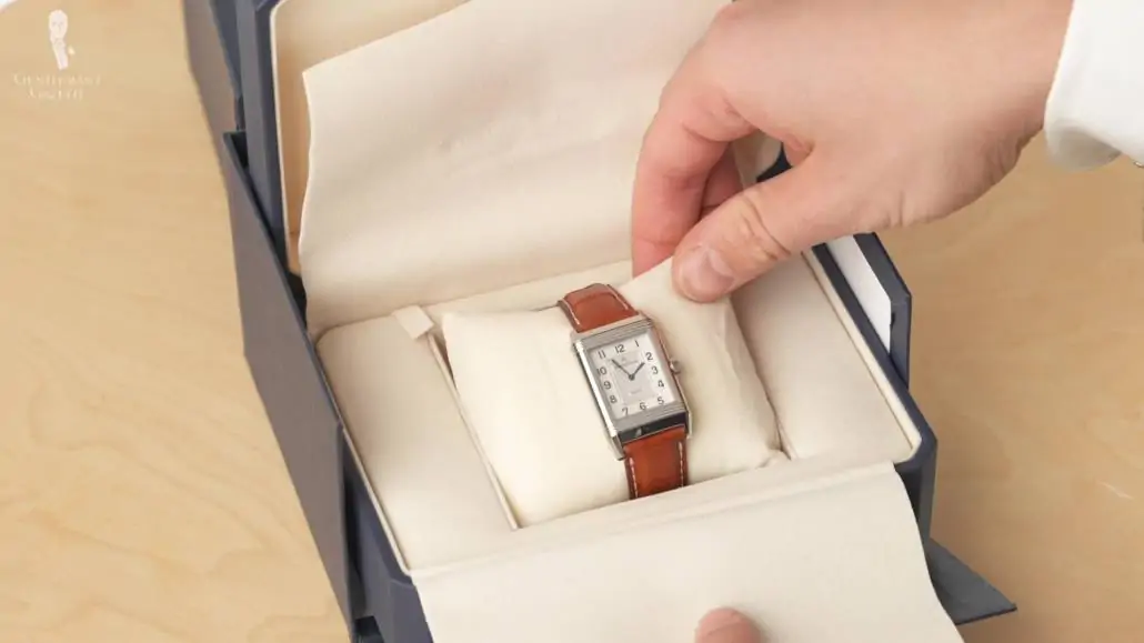 JLC Classic Reverso Watch with brown leather strap inside a blue box packaging 