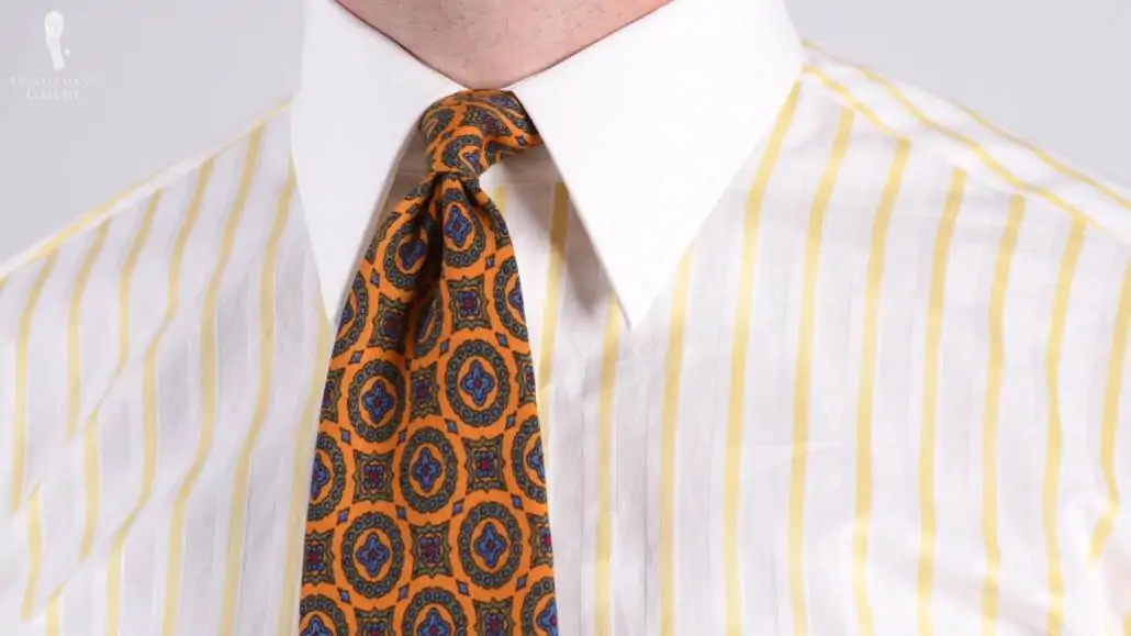 Light yellow striped Winchester shirt with point collar pairted with Wool Challis Tie in Sunflower Yellow with Green,Blue and Red Pattern from Fort Belvedere