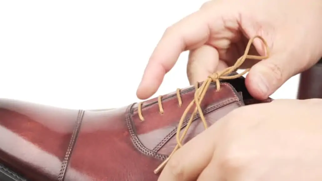 Raphael showing the Berluti knot aligned to the axis of the shoe. 