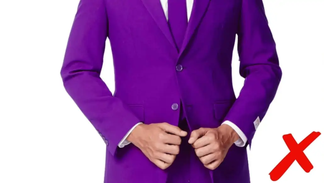 A man wearing a bright purple-colored suit.