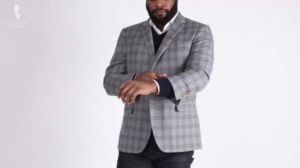 Kyle wearing a light gray sport jacket with windowpane check
