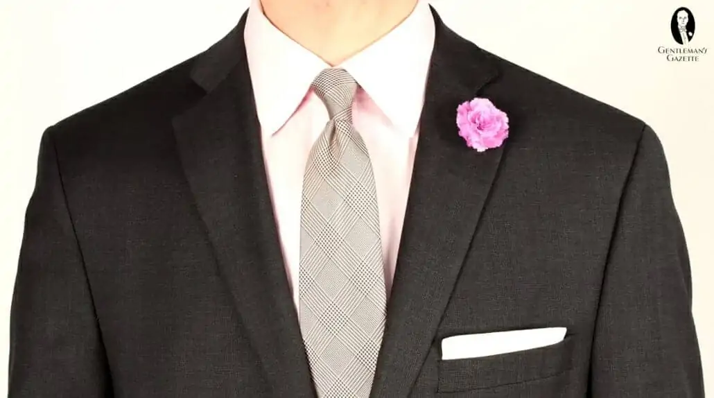 A pink shirt pairs especially well with a charcoal gray suit.
