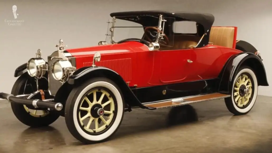 A vintage automobile with a removable canvas top