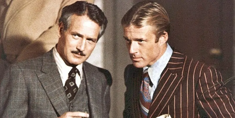 Paul Newman and Robert Redford wearing two different patterned suits