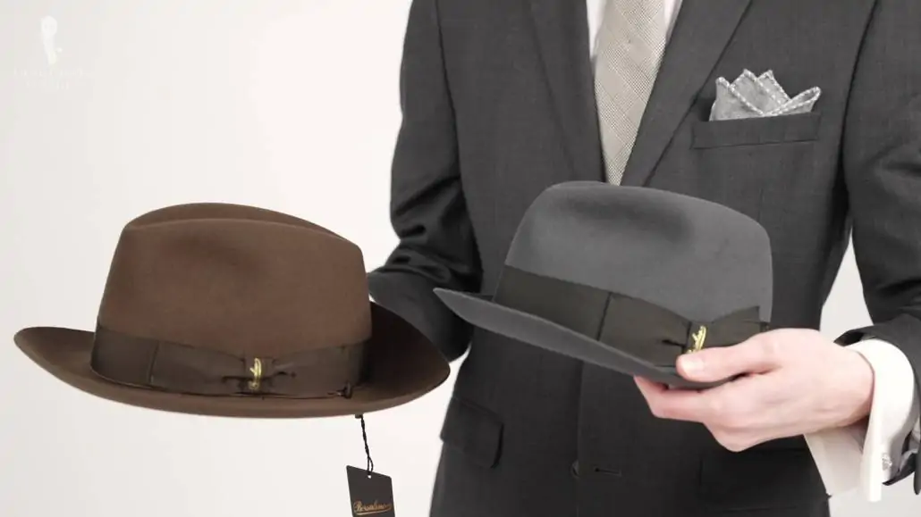 Preston holding two different Borsalino hat styles