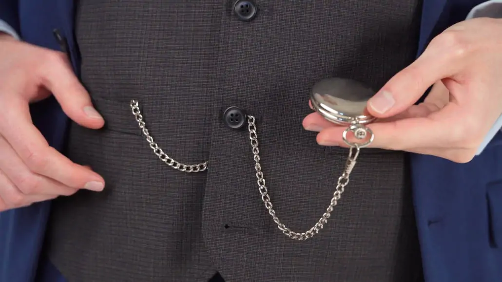Preston wearing a pocket watch with an albert double chain