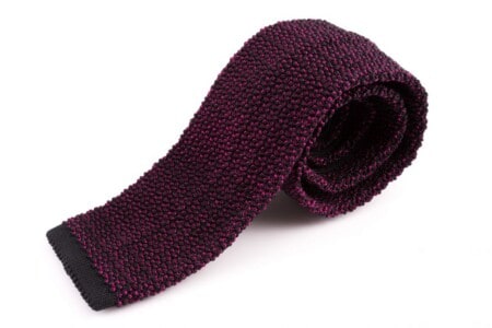 Two-Tone Knit Tie in Black and Magenta Pink Changeant Silk by Fort Belvedere on white background
