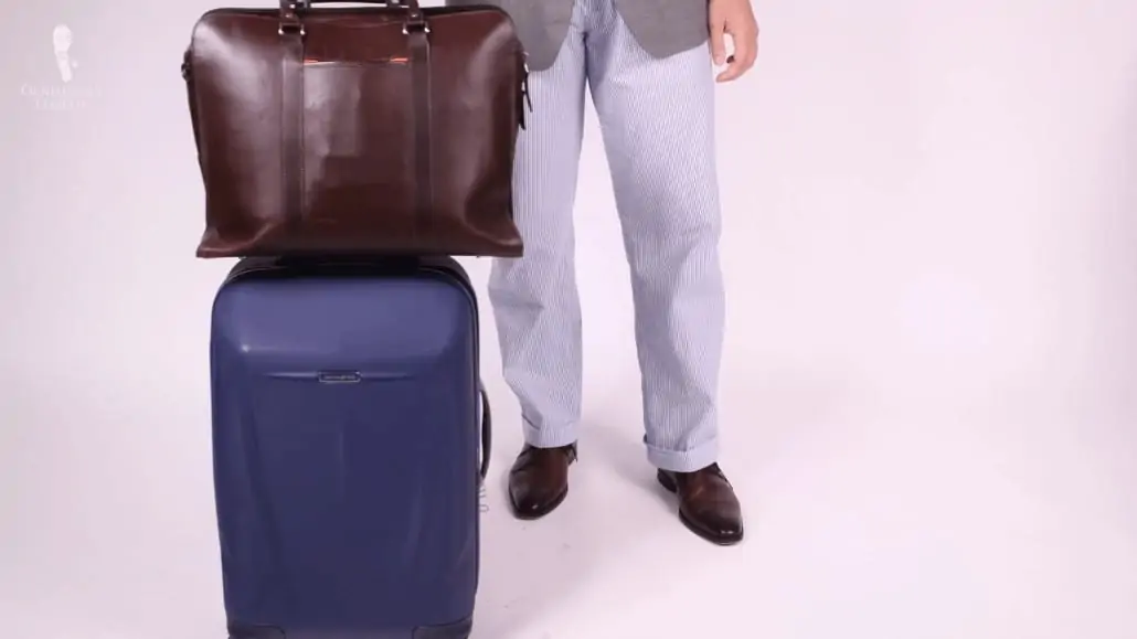 A messenger bag is a more practical and classic option for traveling.