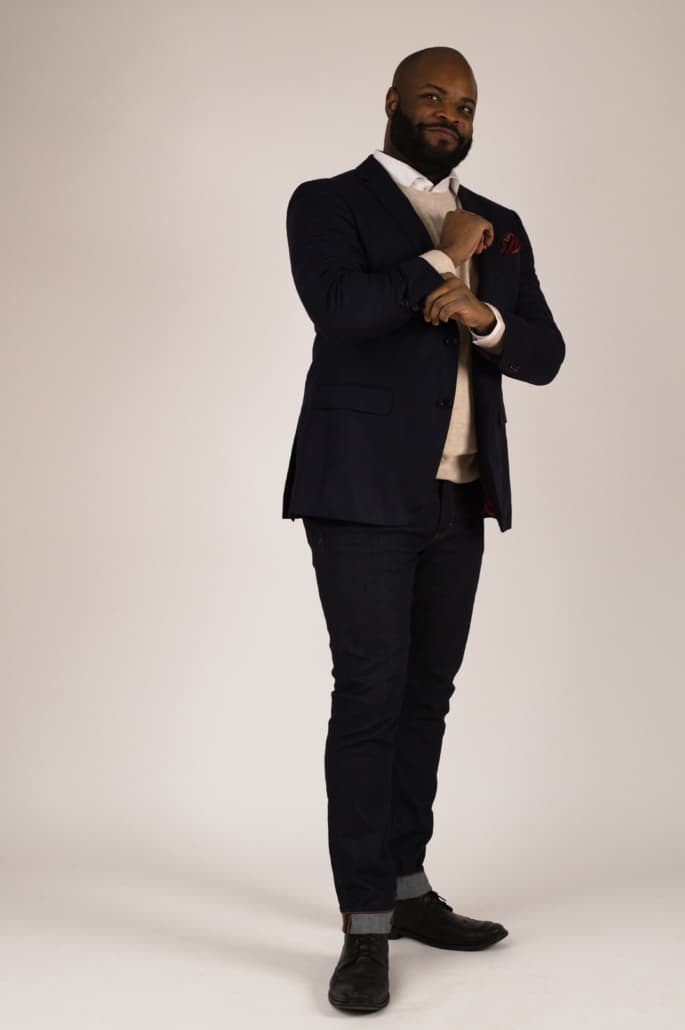 Kyle Navy Blazer Cream Knit Long Sleeves White Dress Shirt Dark Wash Denim Jeans Black Boots Wine Red Medallion Pocket Square Fort Belvedere.jpg 685X1030 1 Kyle here pairs a navy blazer with dark-wash denim, a white shirt, and a cream-colored sweater