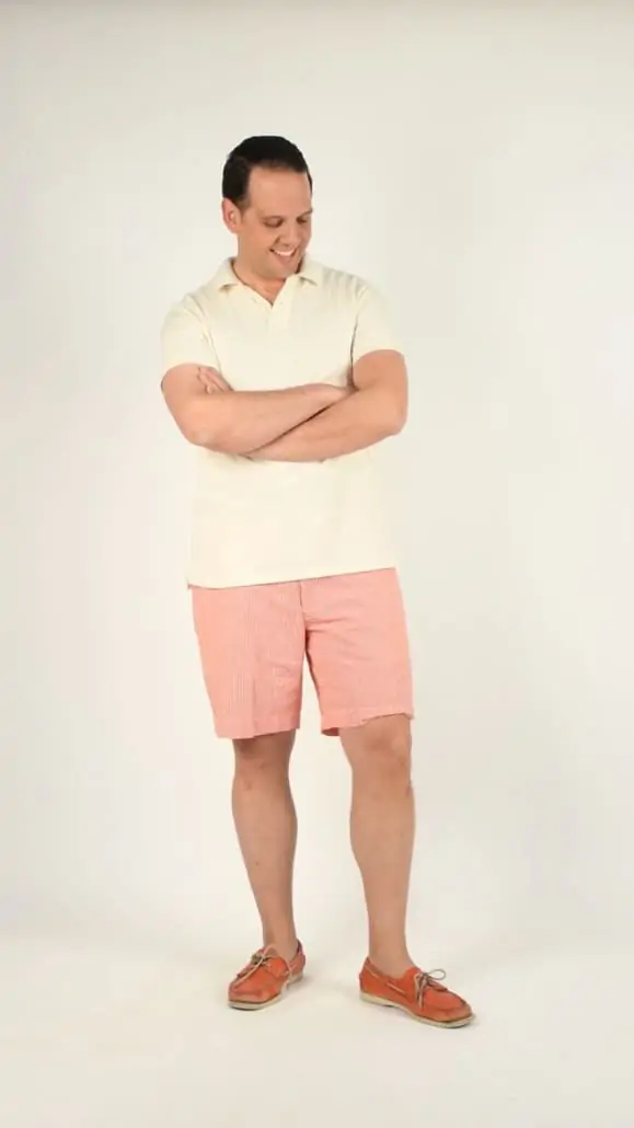 SRS in off white solid polo shirt, checked red and white, seersucker shorts, salmon boat shoes
