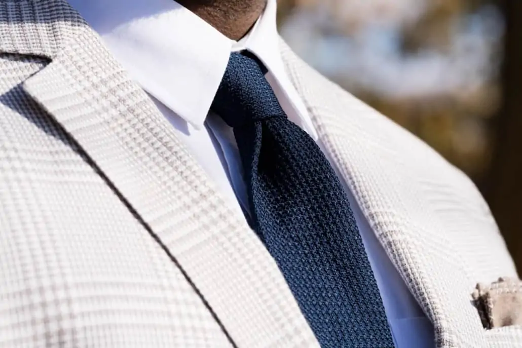 A navy grenadine tie is versatile and adaptable, making it a great addition to any man's wardrobe.