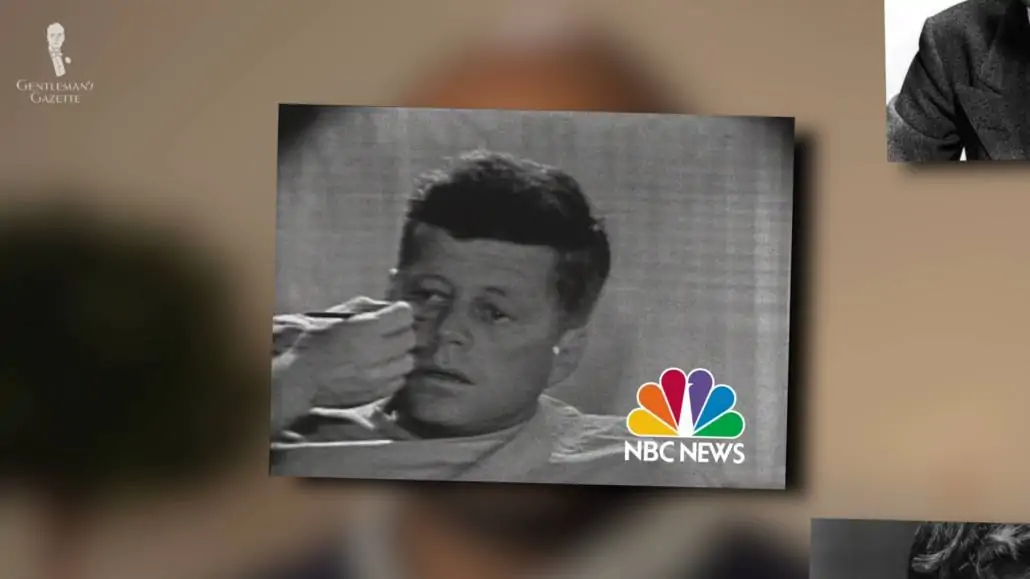 President John F. Kennedy having makeup put on his face.