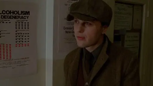 Jimmy Darmody in a tweed Norfolk jacket and a baker boy cap.
