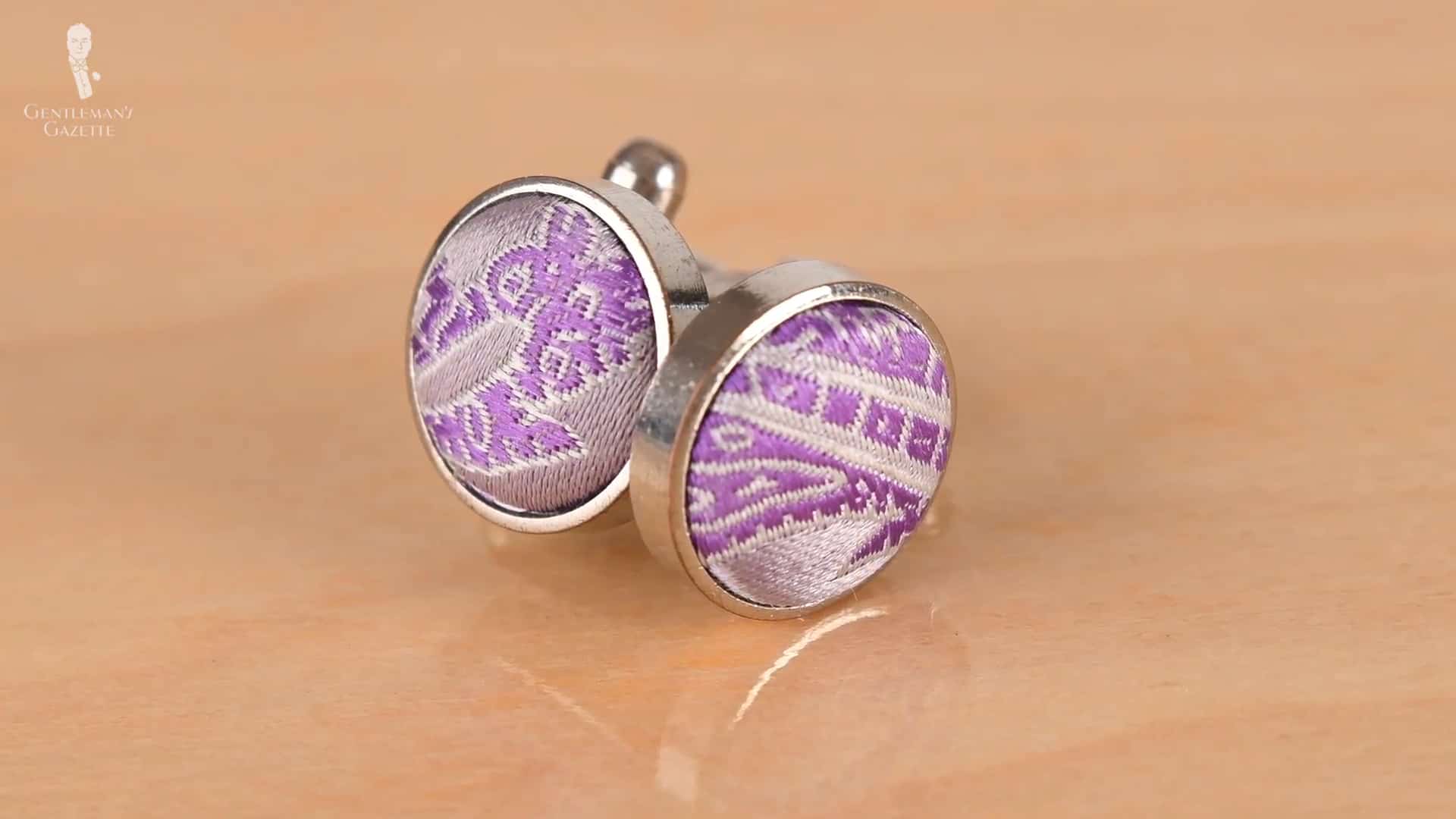 Cufflinks face made with fabric.