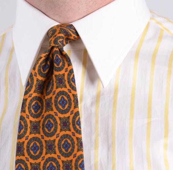 Light Yellow Striped Winchester Shirt With Point Collar Paired With Wool Challis Tie In Sunflower Yellow With Green Blue And Red Pattern From Fort Belvedere Light yellow striped Winchester shirt with point collar paired with Wool Challis Tie in Sunflower Yellow with Green, Blue and Red Pattern from Fort Belvedere