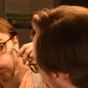 Preston shaving his cheeks with a DE razor