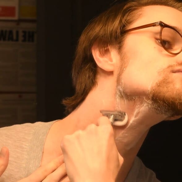 Preston shaving his neck with a DE razor