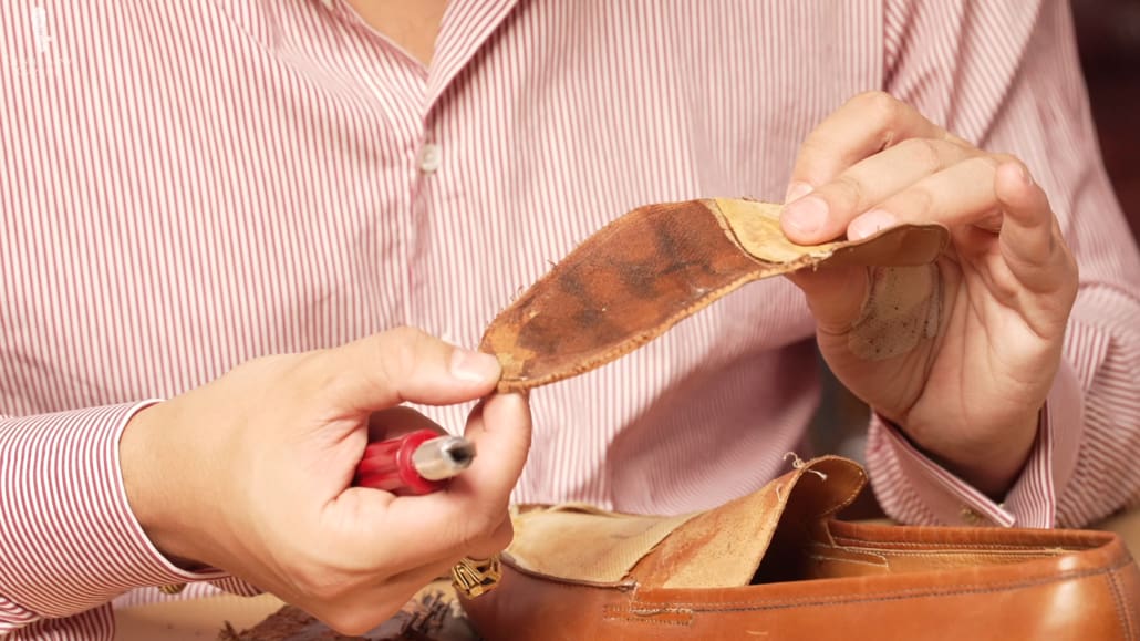 Raphael examines the outer vamp of the Lobb Paris shoe.