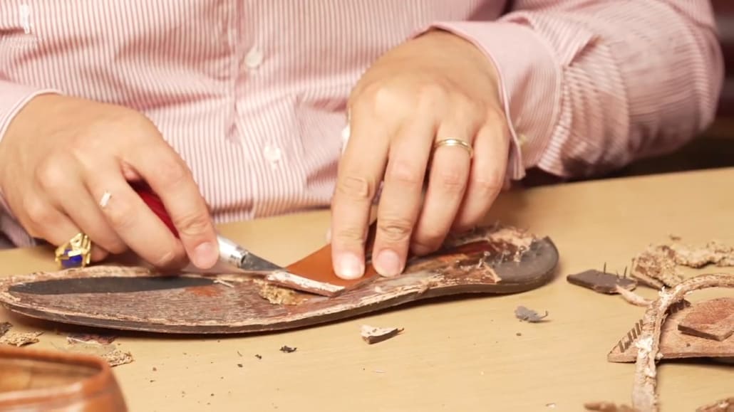 Raphael examines the removed Lobb Paris sole.