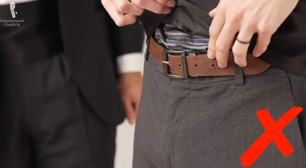 A bad bulky idea - wearing a belt underneath your cummerbund.