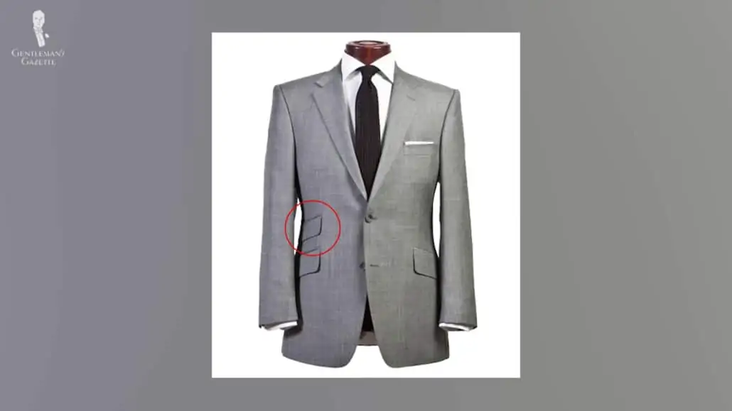 A gray suit with flap pockets and ticket pocket