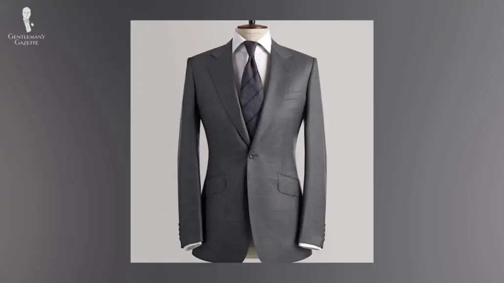 A gray suit with slanted flap pockets