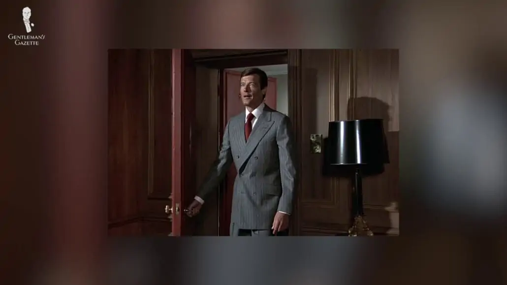 Roger Moore's James Bond in a gray double-breasted suit.