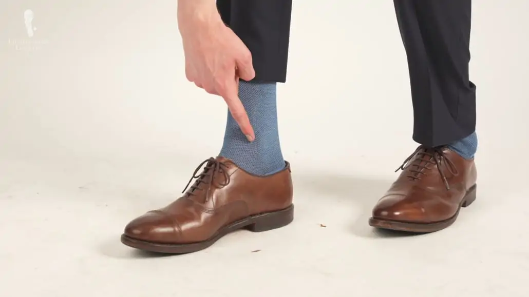 Brown cap-toed Oxfords paired with a two-tone socks from Fort Belvedere