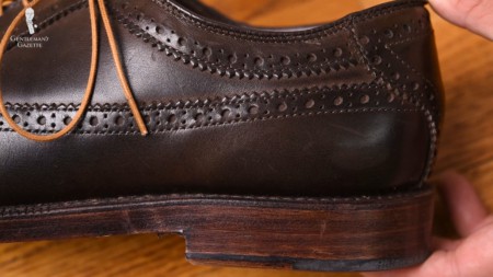 Dark brown brogue shoe paired with light brown shoelaces