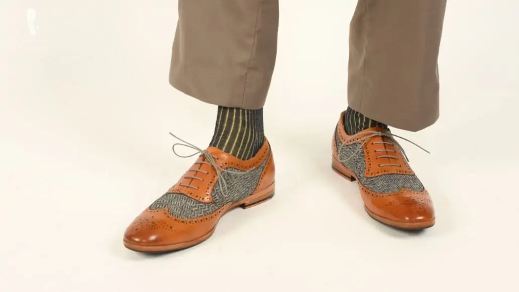 Goodyear welted brogue Strange Island shoes paired with a yellow and gray shadow striped socks from Fort Belvedere