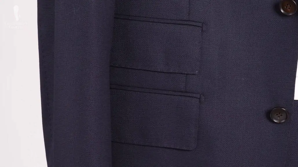 Navy suit with a ticket pocket