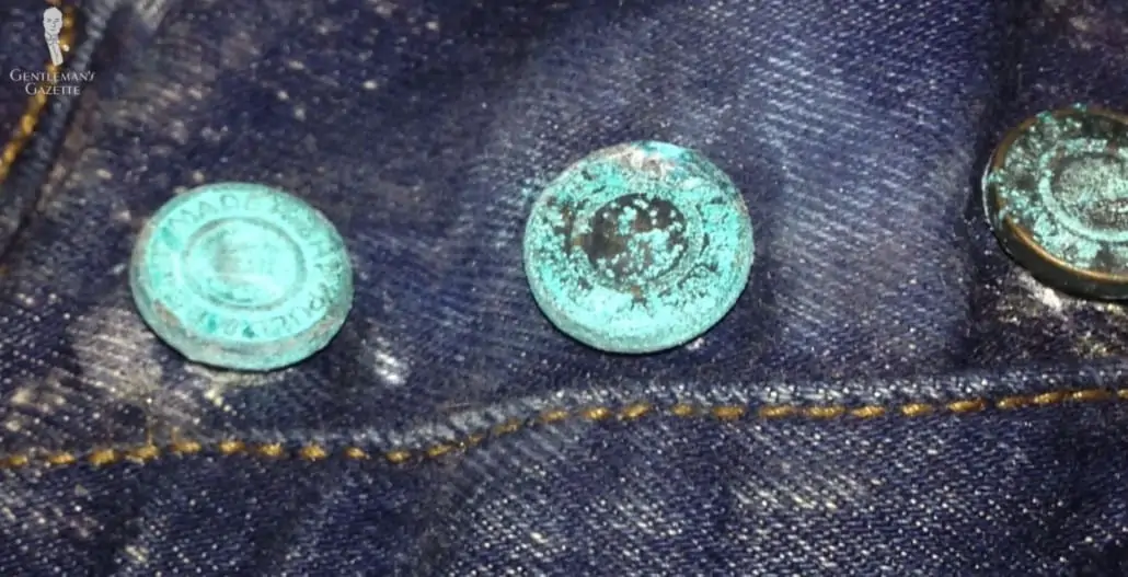 Oxidizing copper buttons on a denim jacket
