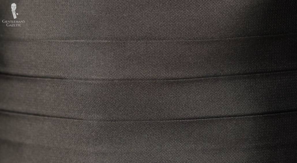 Pleats on a cummerbund up close