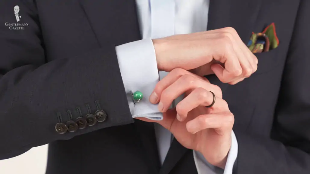 Preston showing the eagle claw design cufflinks that feature malachite as the stone.