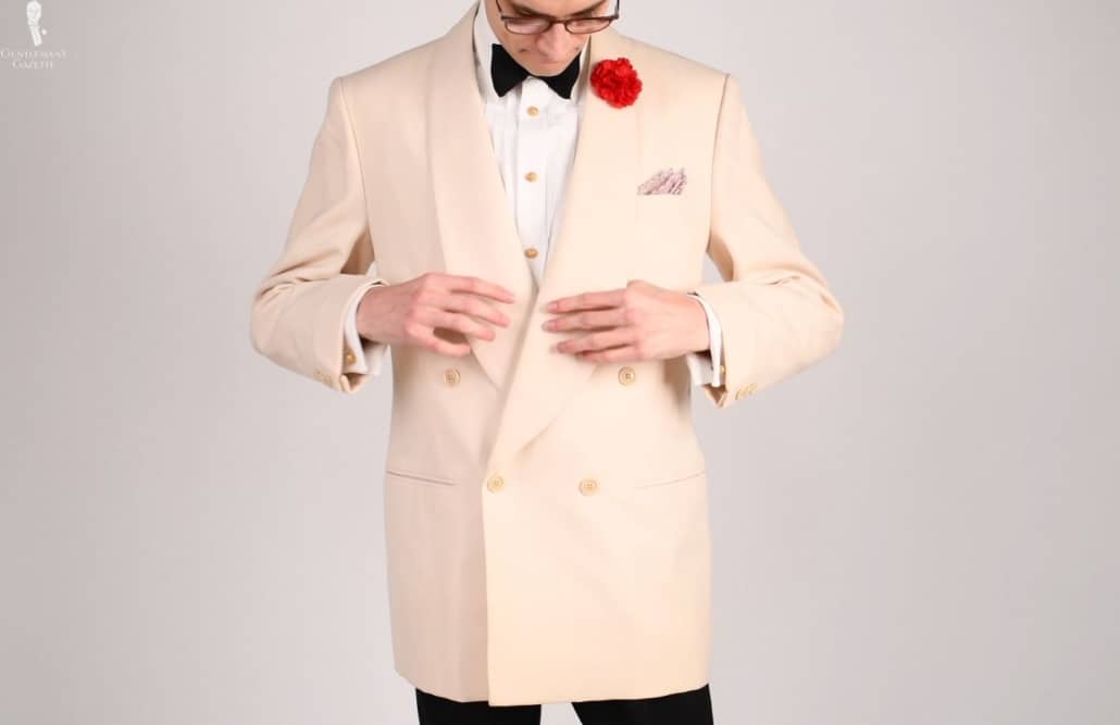 Preston wearing an ivory dinner jacket à la James Bond.