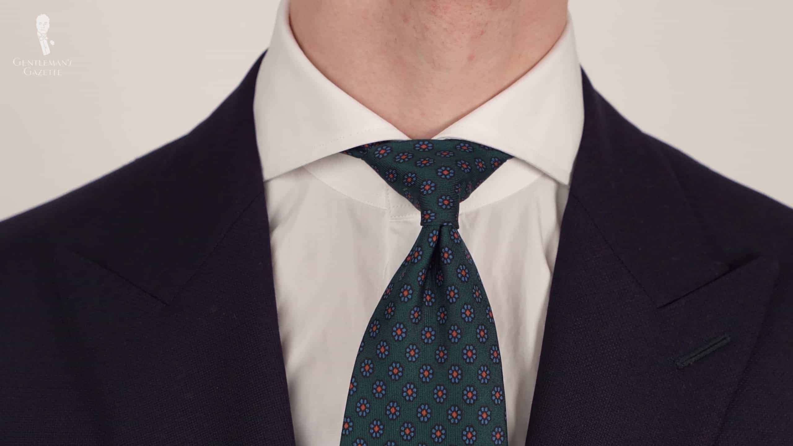 White Shirt With Wide Spread Collar Paird With A Madder Silk Tie In Bottle Green Macclesfield. Scaled White shirt with wide spread collar paired with a madder silk tie in bottle green Macclesfield.