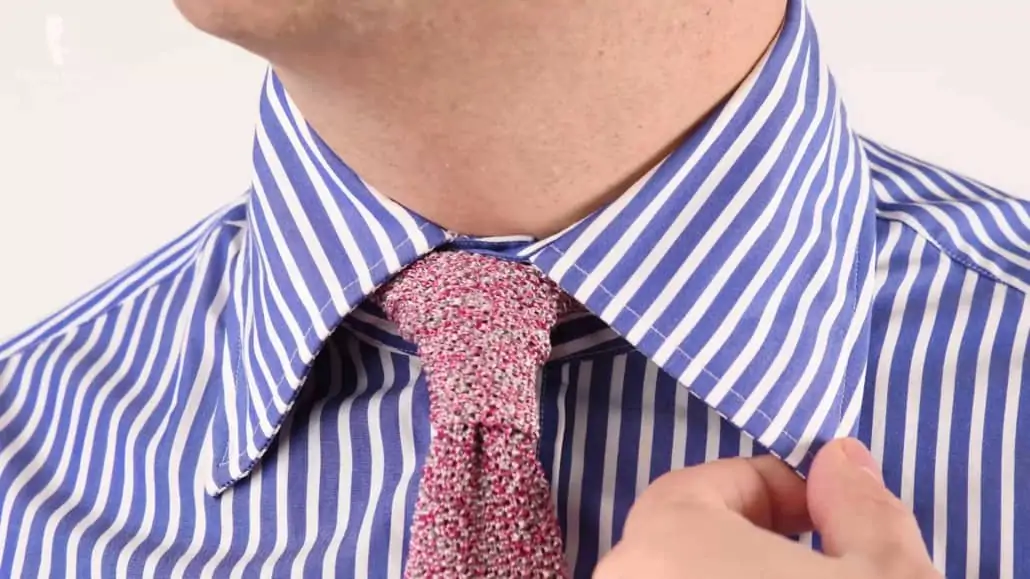 A blue and white stiped shirt's collar