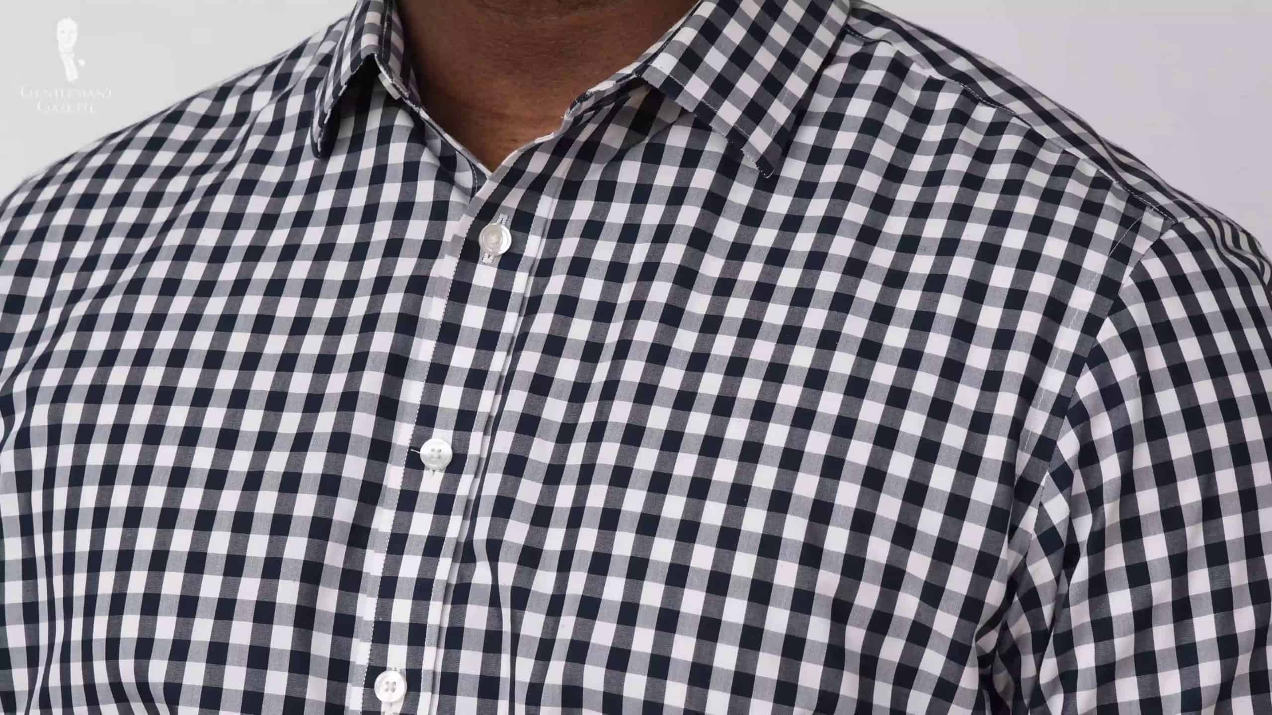 A dress shirt with a replaced button.