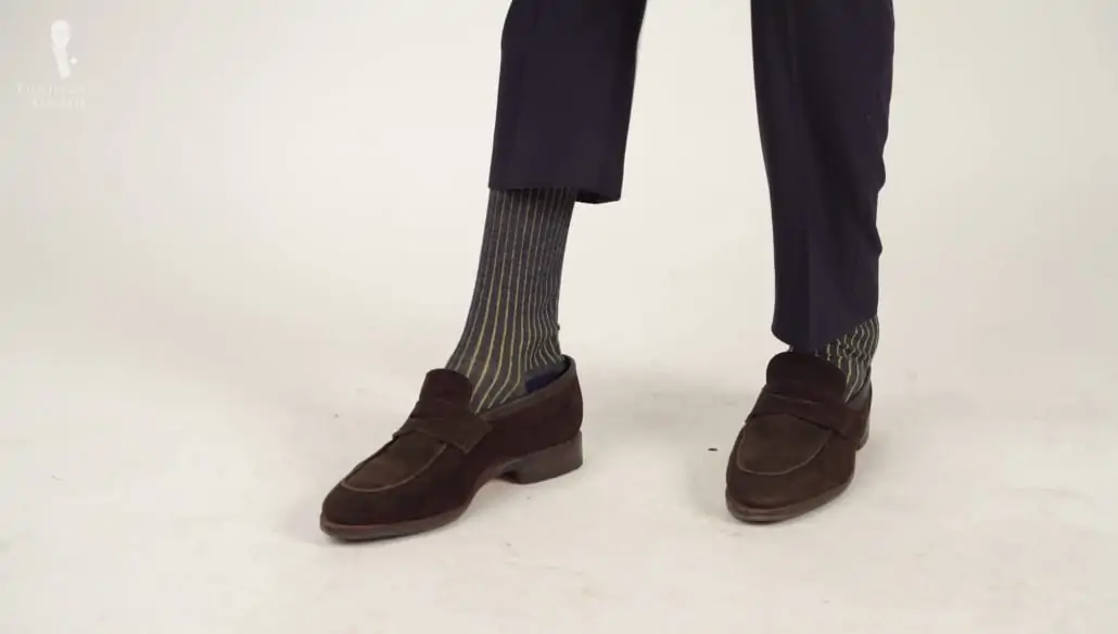 Suede loafers from Meermin paired with shadow-striped socks in navy blue and yellow from Fort Belvedere.