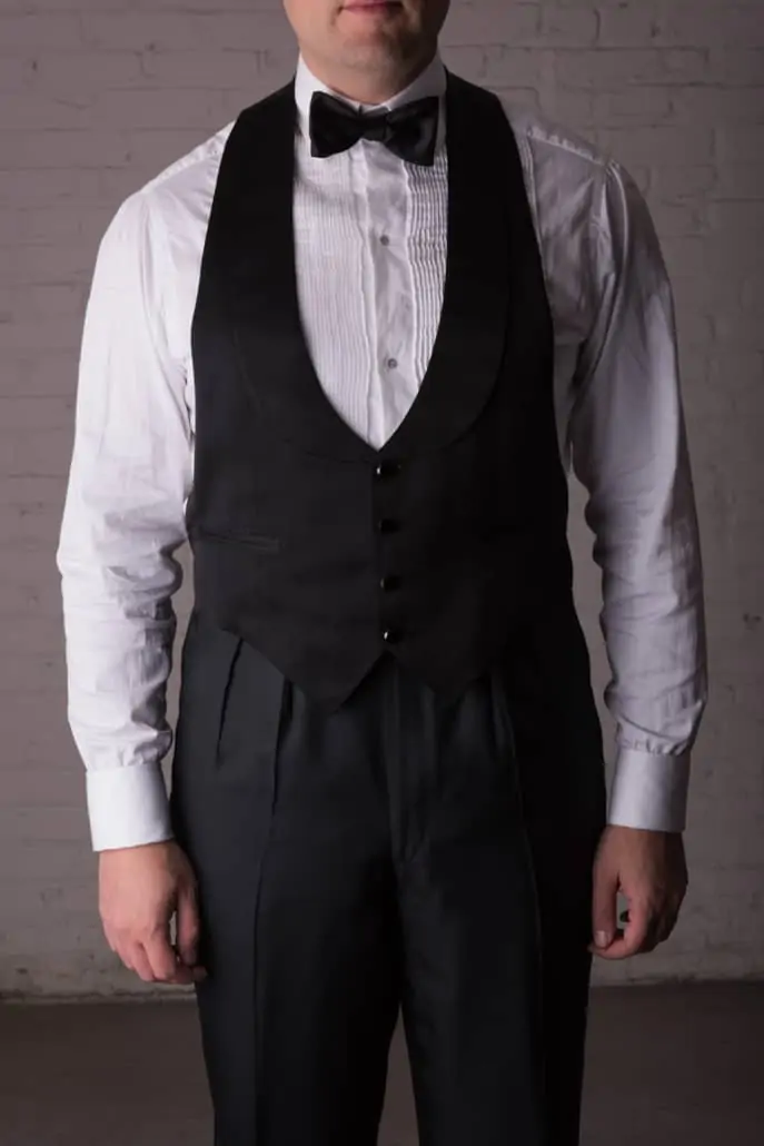 Raphael shows off a vintage evening waistcoat in black