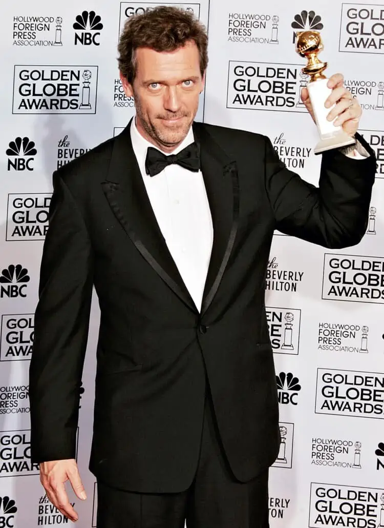 Hugh Laurie wearing a trimmed dinner jacket, which is something you might recognize from blazers